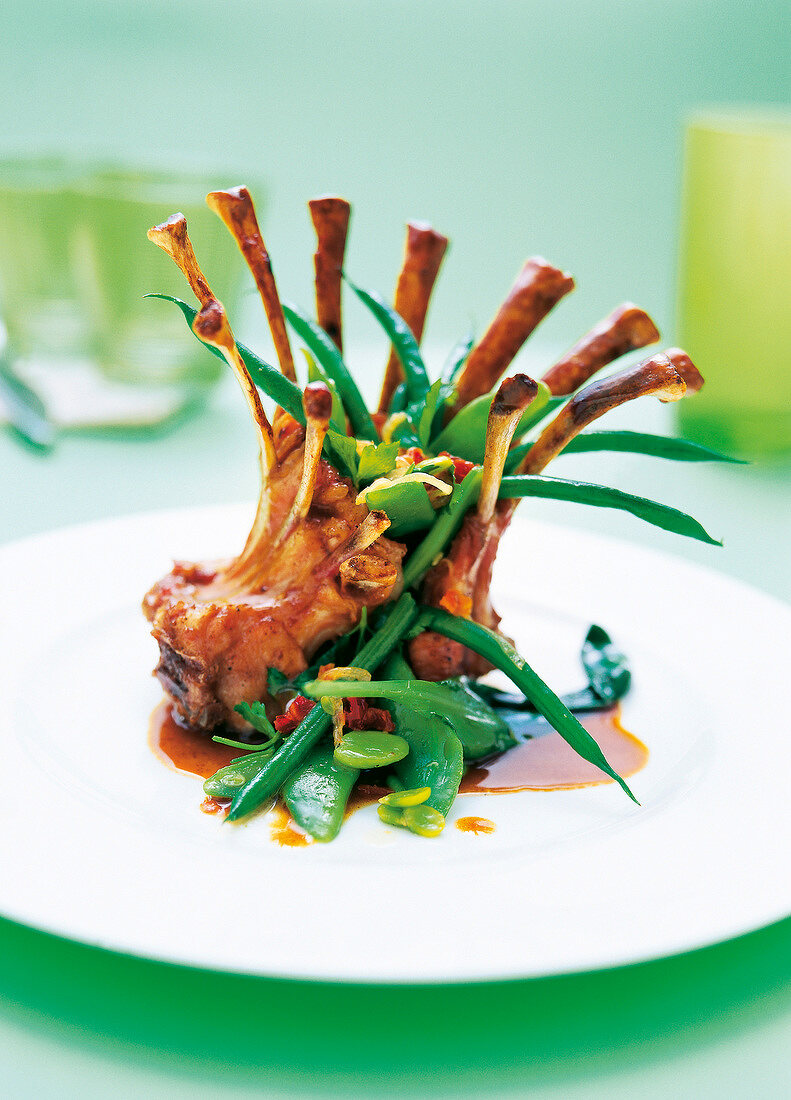 Close-up of crown shaped kids and beans on plate