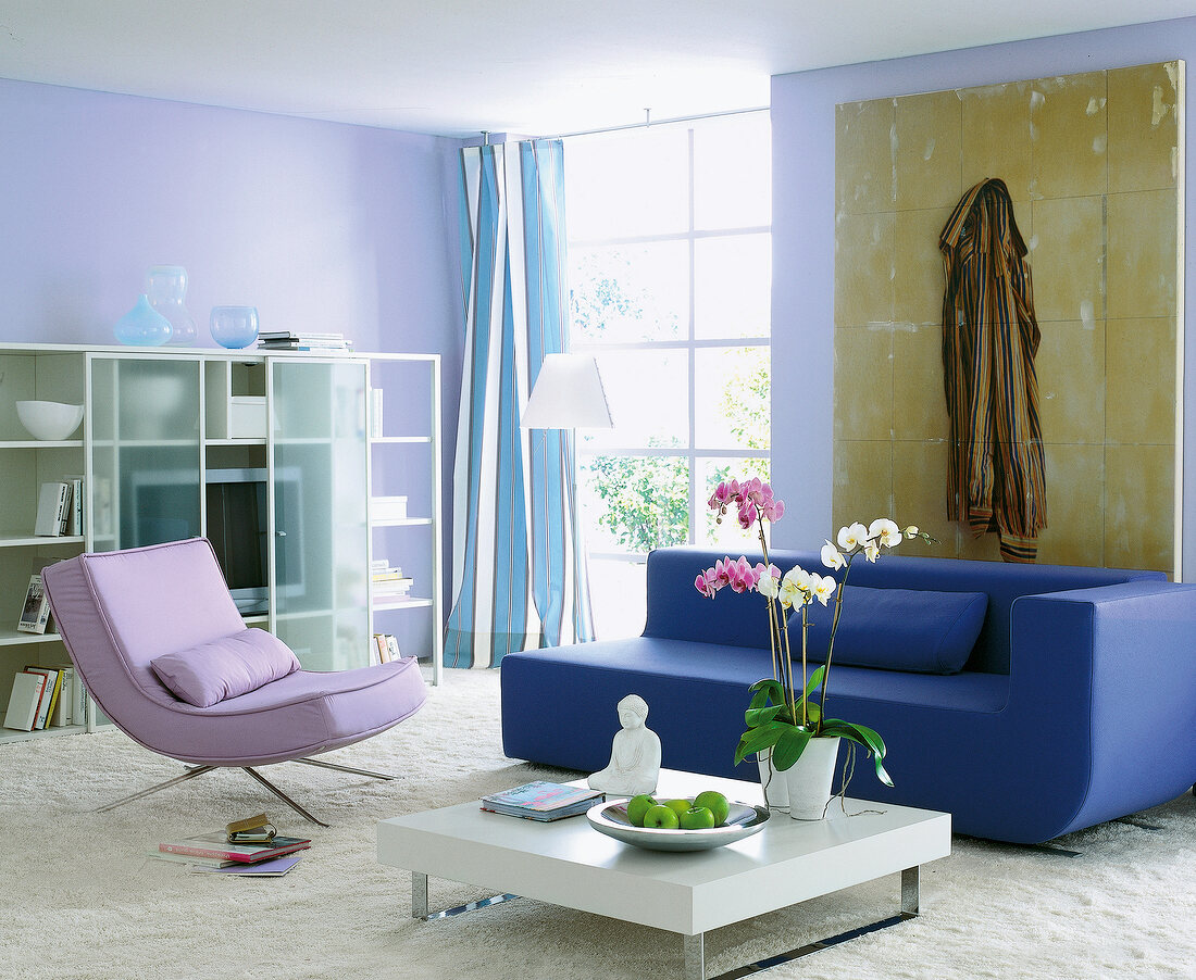 Bright living room decorated in blue, white and lilac colours