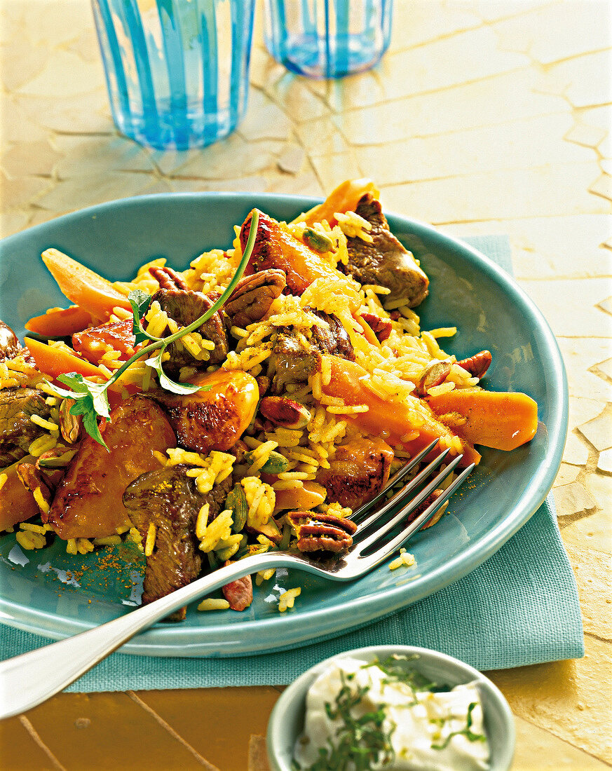 Close-up of lamb pilaf with apricot on plate