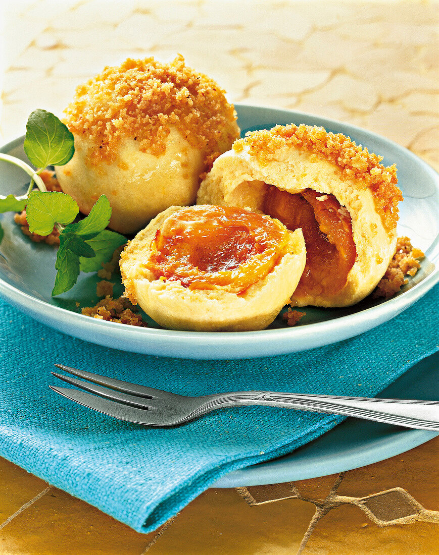 Close-up of apricot dumplings on plate