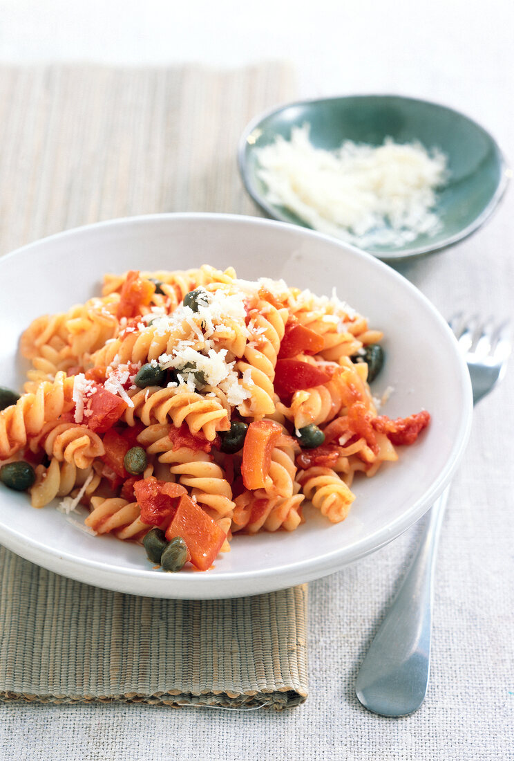 Fusilli with peppers and sauce on plate