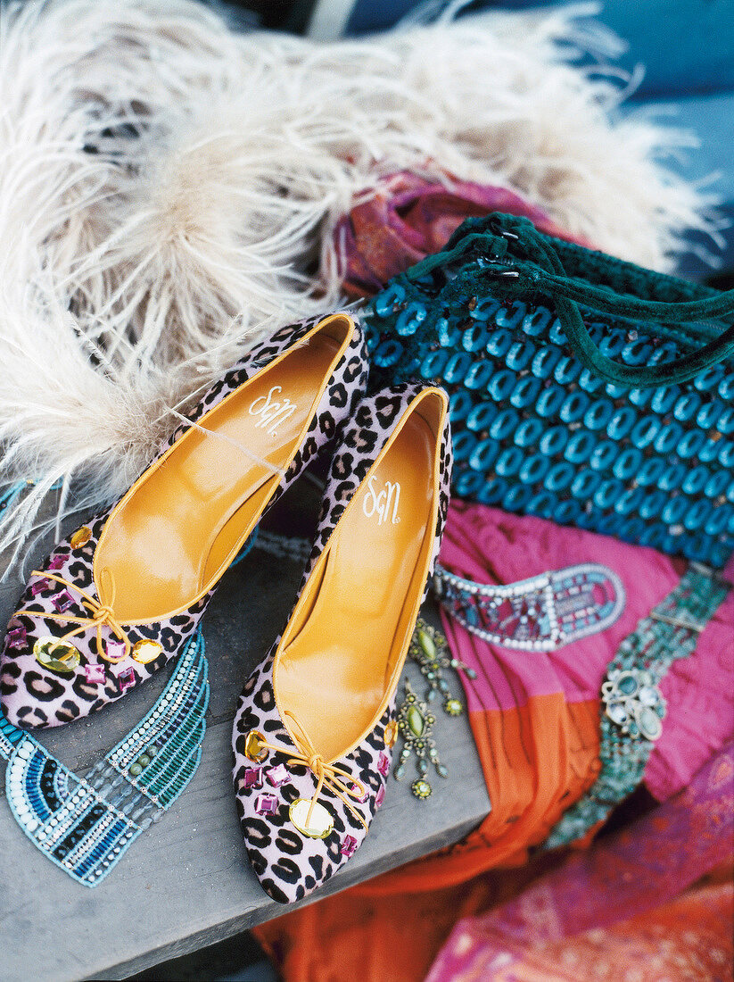 Various fashion accessories like heels and handbag