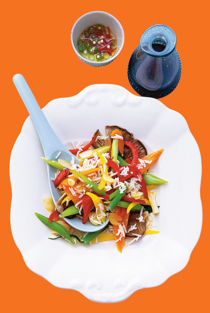 Vegetable and rice on white plate, overhead view