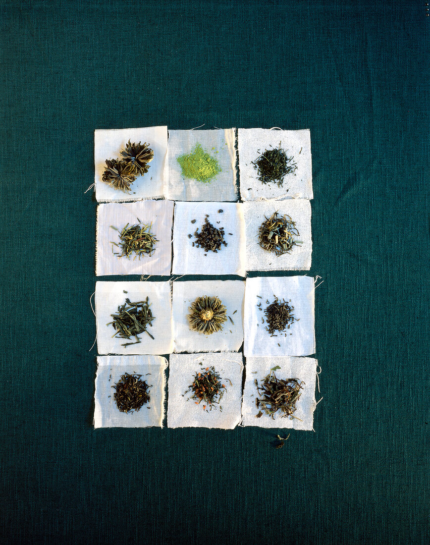 Twelve different Chinese green teas on cloth