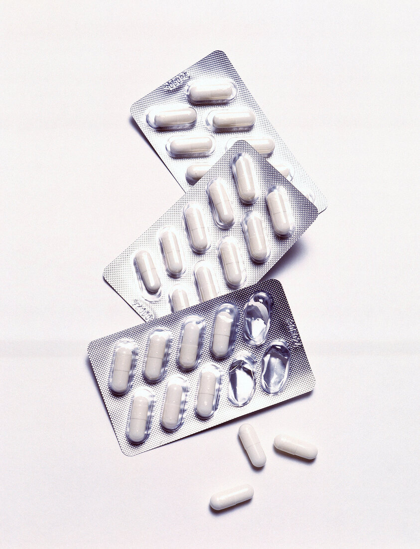 Close-up of several tablets on white background