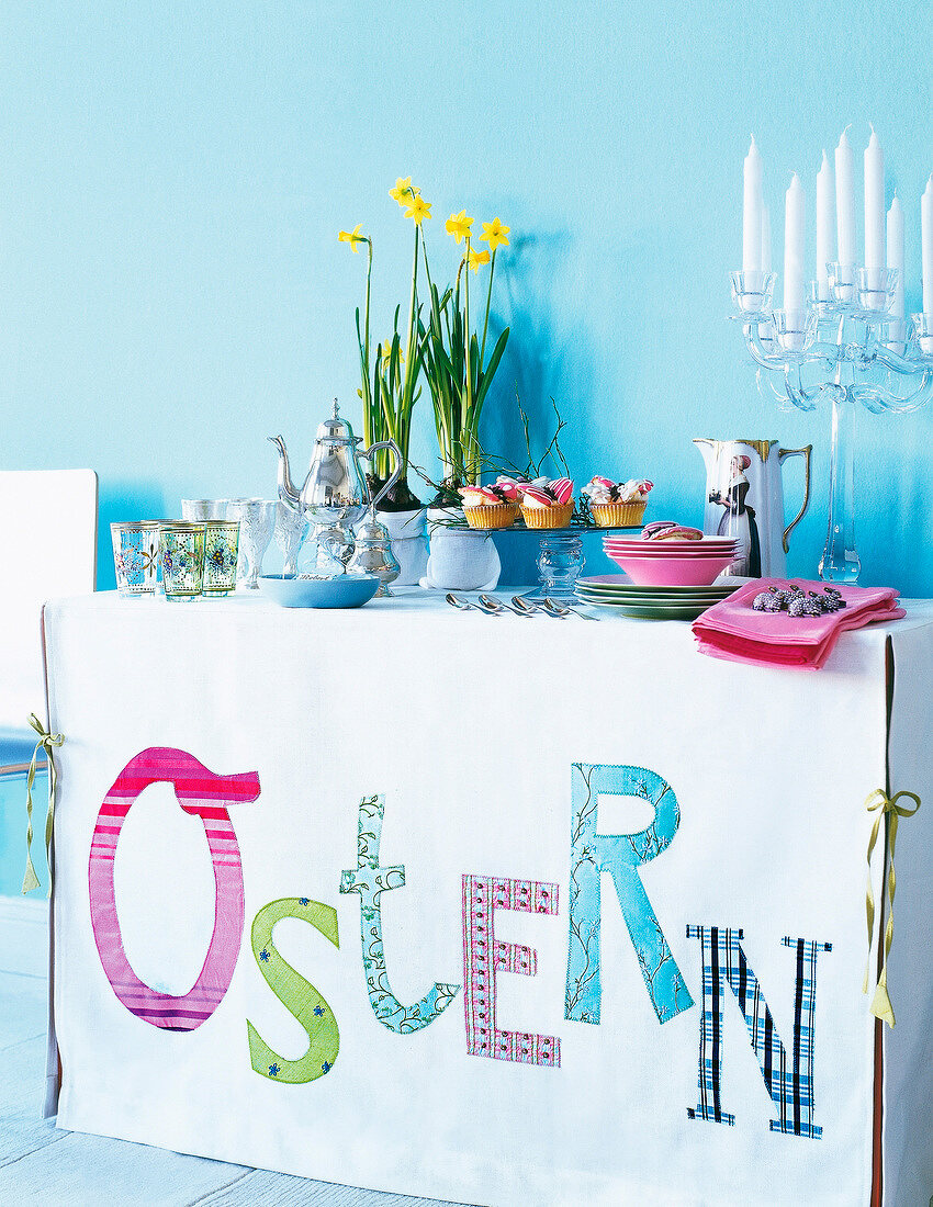 Easter brunch buffet lined on table with self-made slipcover reading 'Ostern'