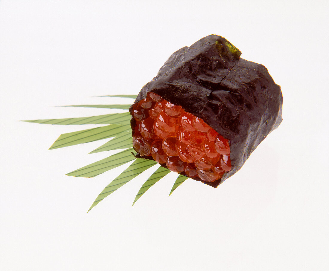 Close-up of canapes with caviar, sushi, rice, yaki nori and salmon caviar