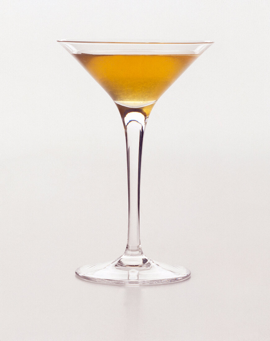 Sweet kiss cocktail in martini glass on white background