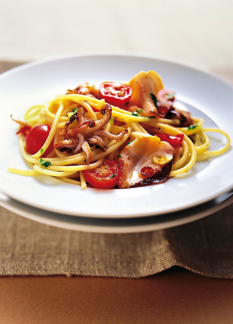 Close-up of spaghetti with calamari on plate