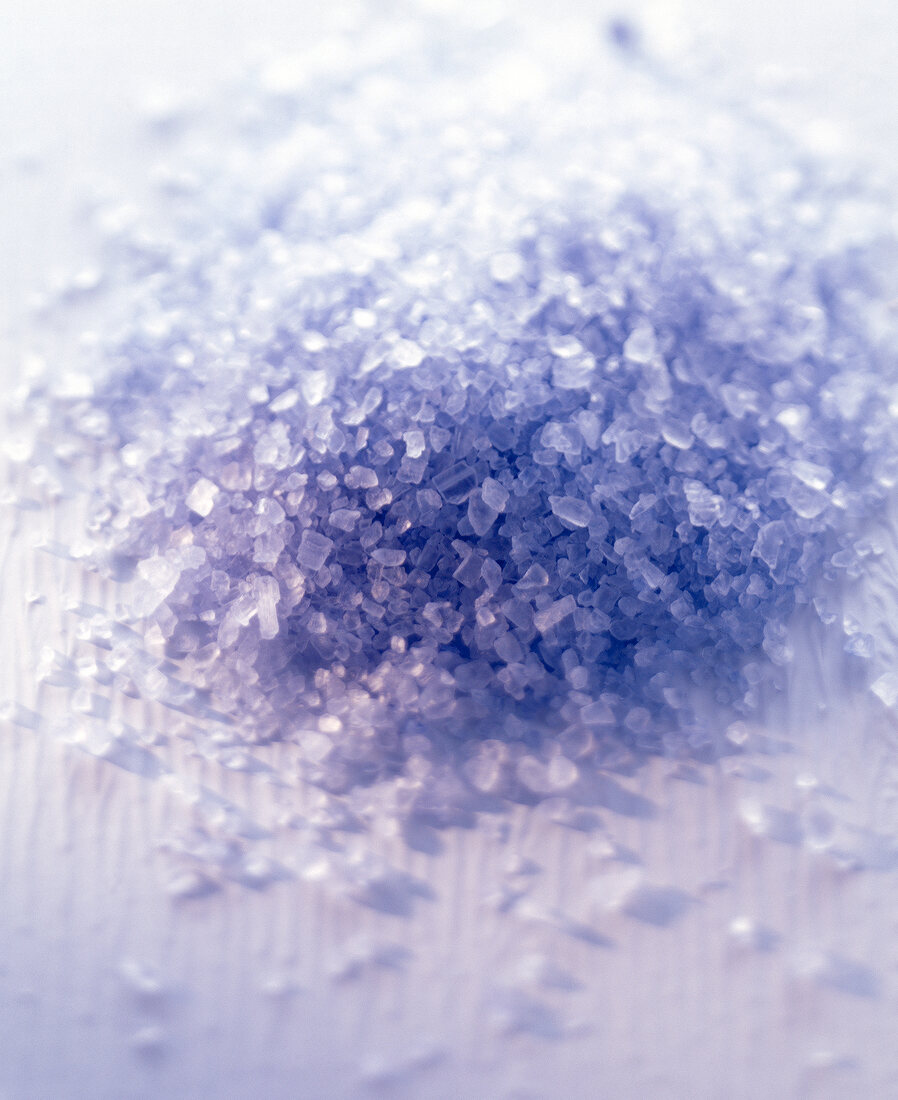 Close-up of heap of blue sea salt on white background