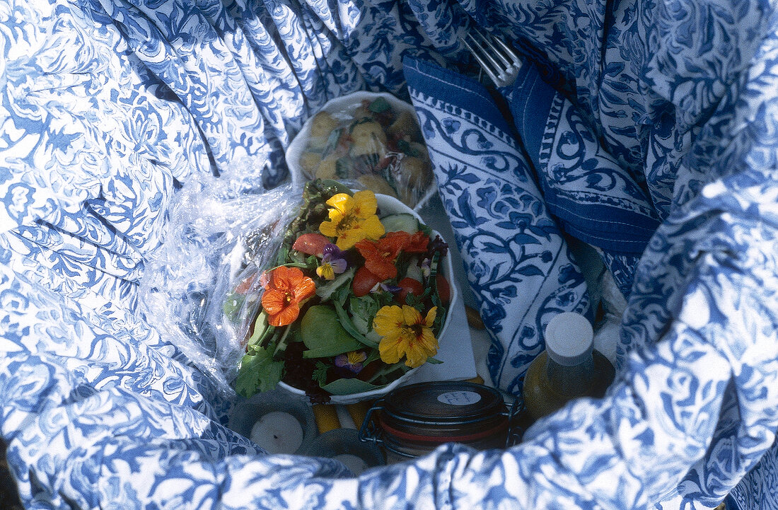 Bowl of flowers salad in basket