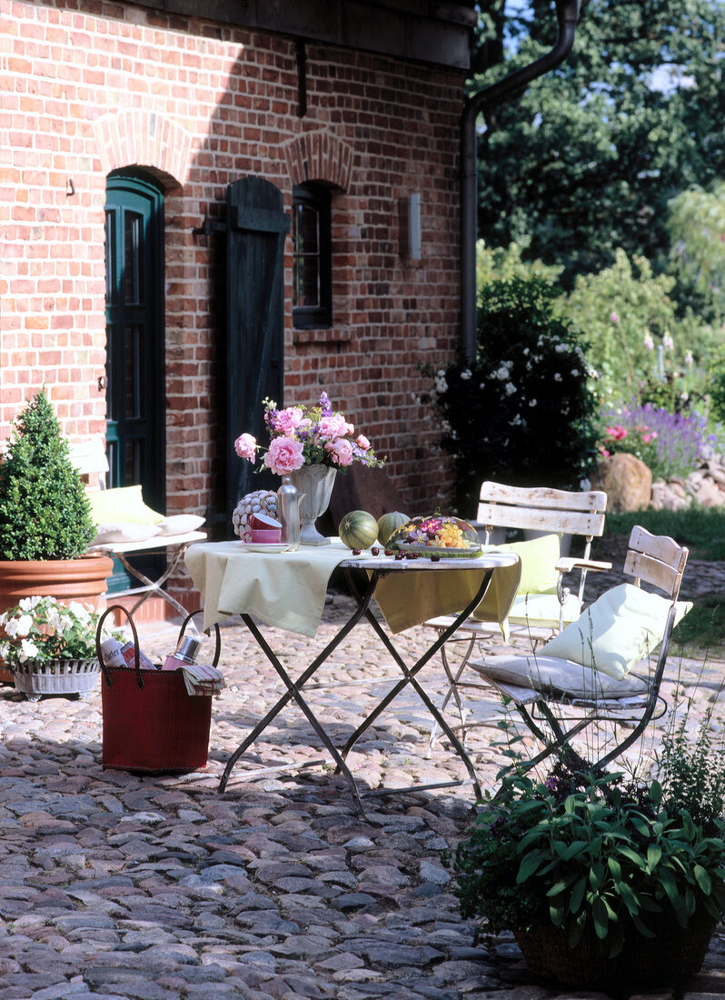 Cosy dining area in front of old farm