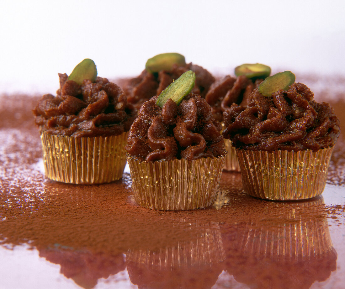 Cinnamon truffle chocolate made with whiskey and almonds and topped with pistachios