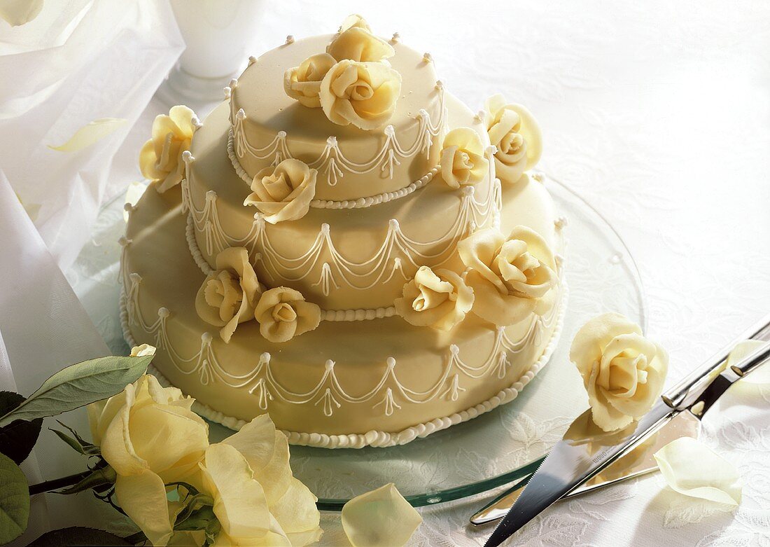 White wedding cake with marzipan roses