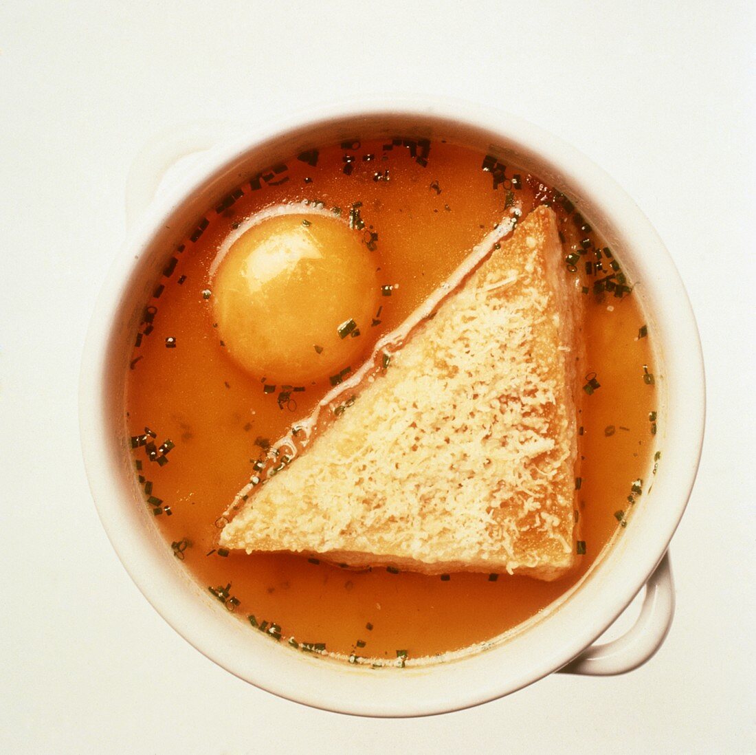 Zuppa pavese (clear broth with raw egg yolk), Italy