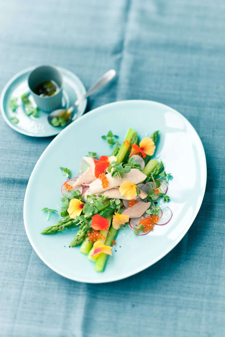 Asparagus salad with smoked trout, caviar and nasturtiums