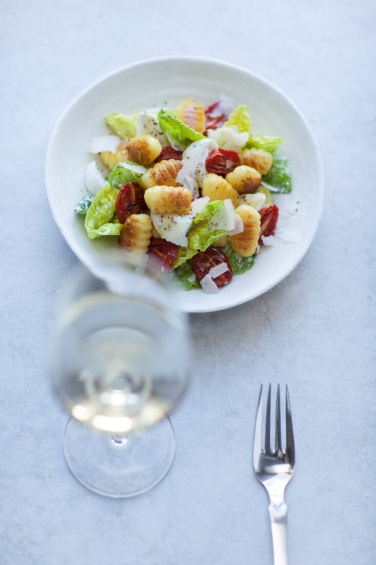 Gnocchi with cos lettuce, dried tomatoes and Parmesan