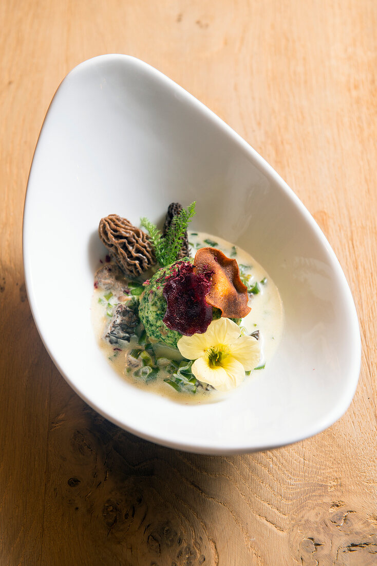 Wild garlic dumplings on a bed of asparagus and morel mushrooms