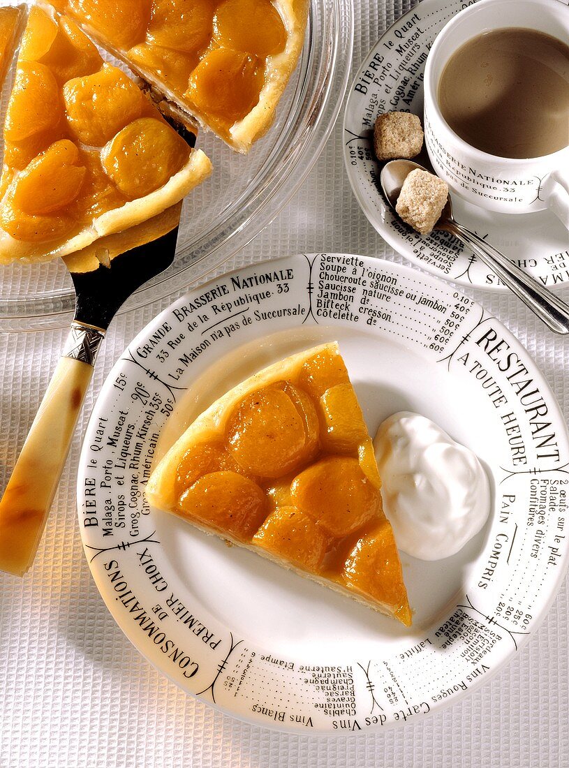Piece of apricot tart with cream