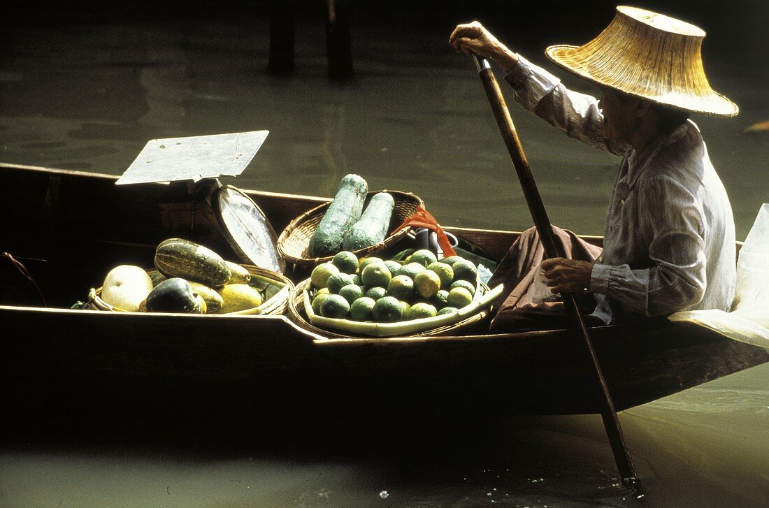 Asian Man with Vegetables and Fruit on Boat