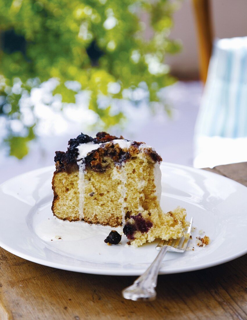 A slice of blueberry butter cake on a plate