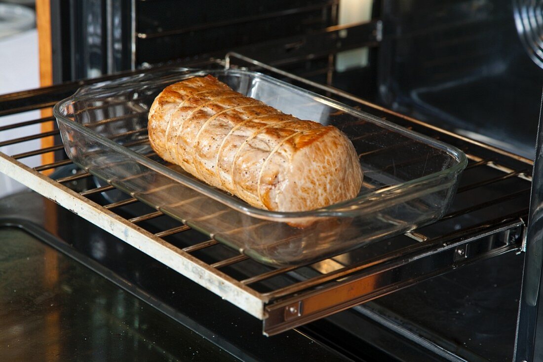 Glazed Pork Loin in a Roasting Pan in the Oven