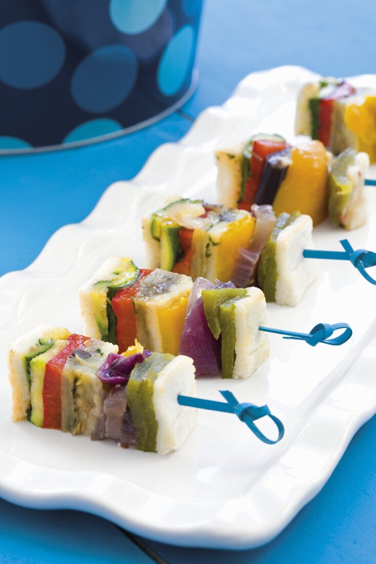 Colourful vegetable skewers with fish