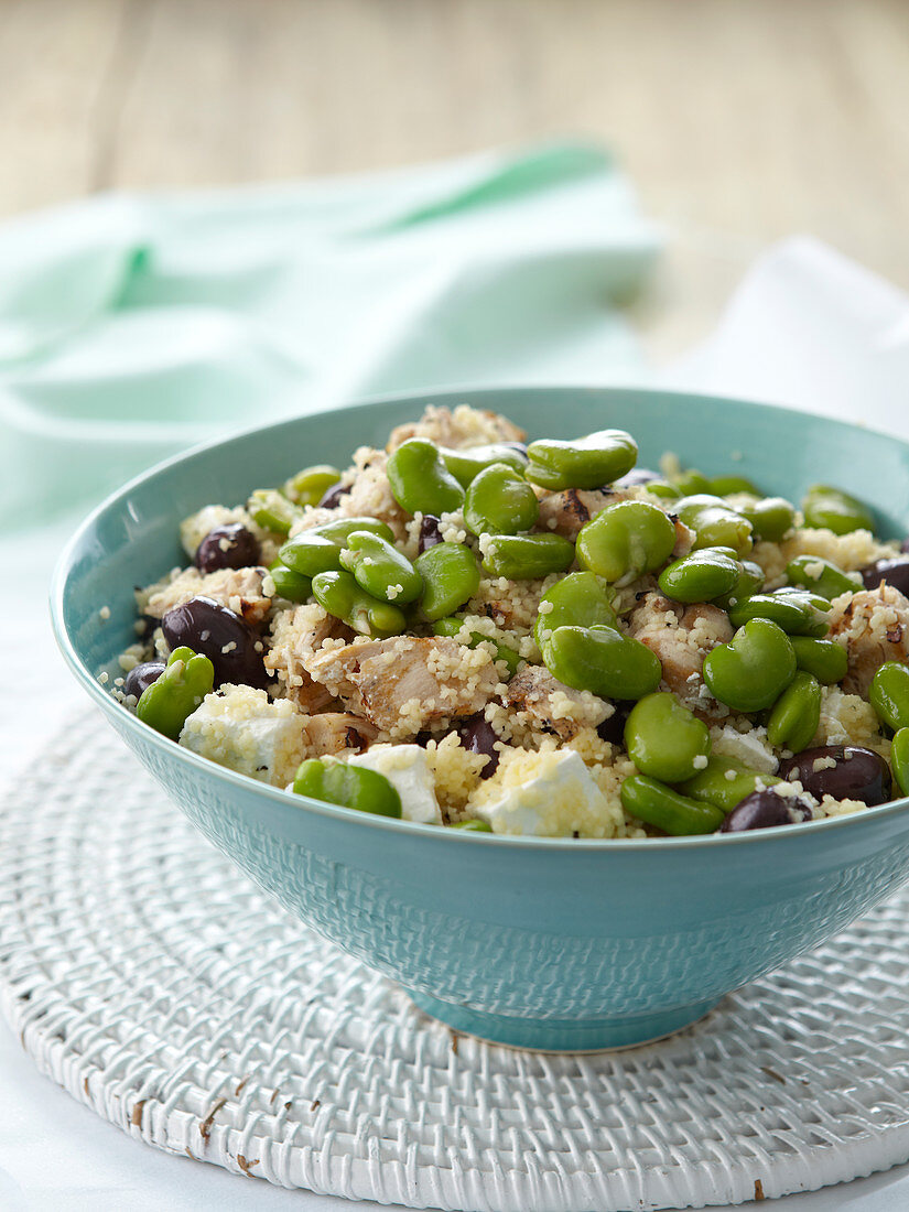 Couscous salad with chicken, broad beans, olives and feta