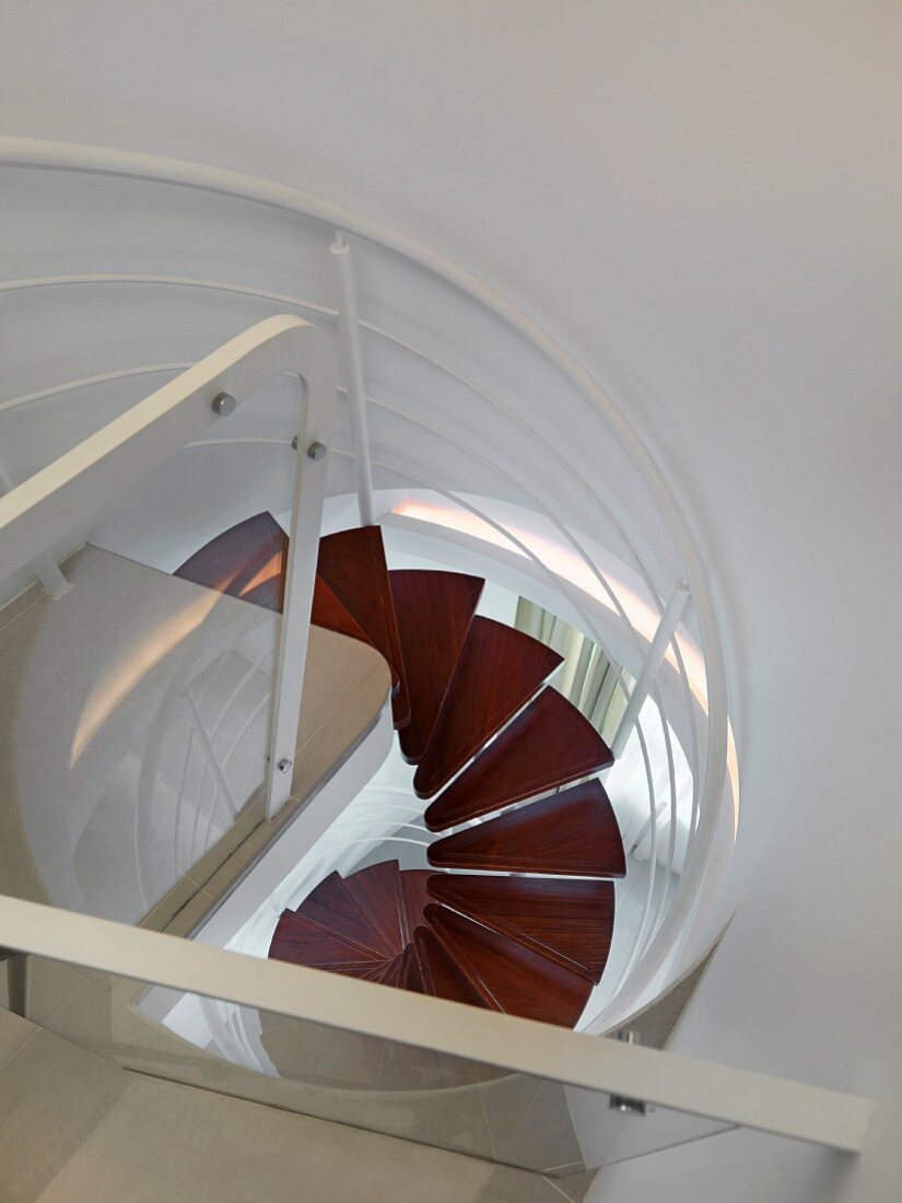 View from top down modern spiral staircase