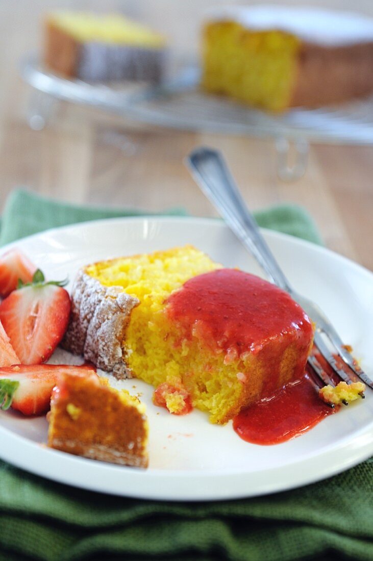 A slice of rice cake with strawberries and strawberry sauce