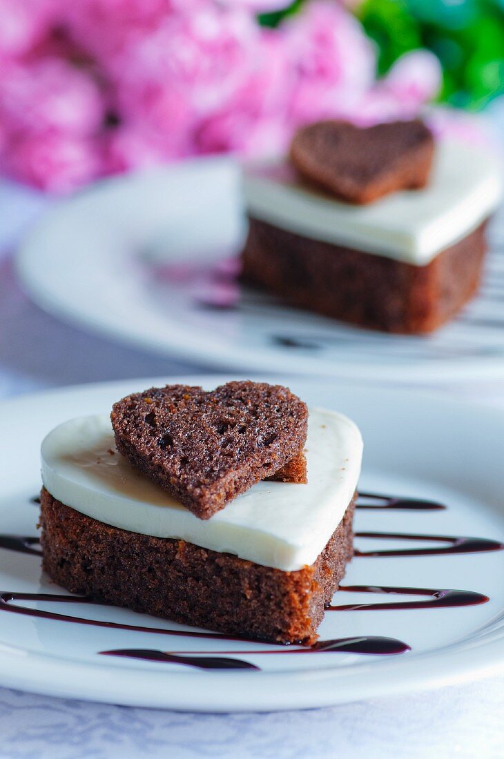Heart-shaped chocolate cake topped with coconut and vanilla jelly