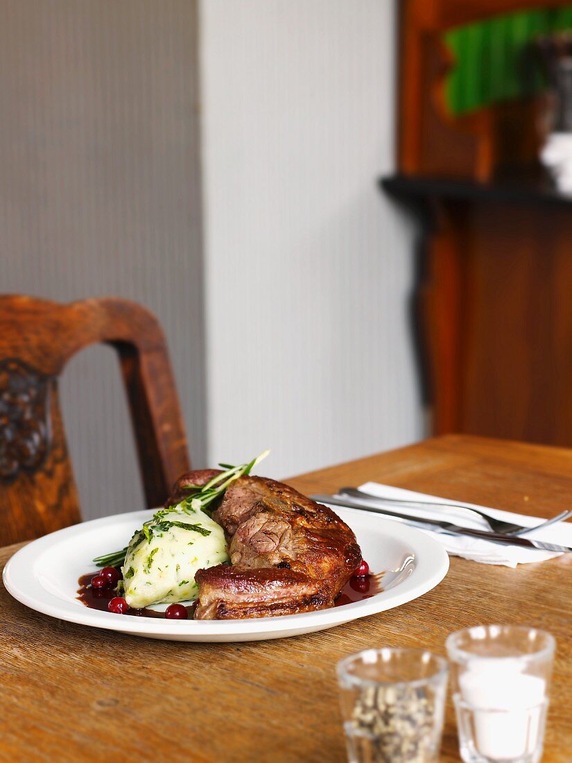 Saddle of lamb with mashed leek and cranberry sauce