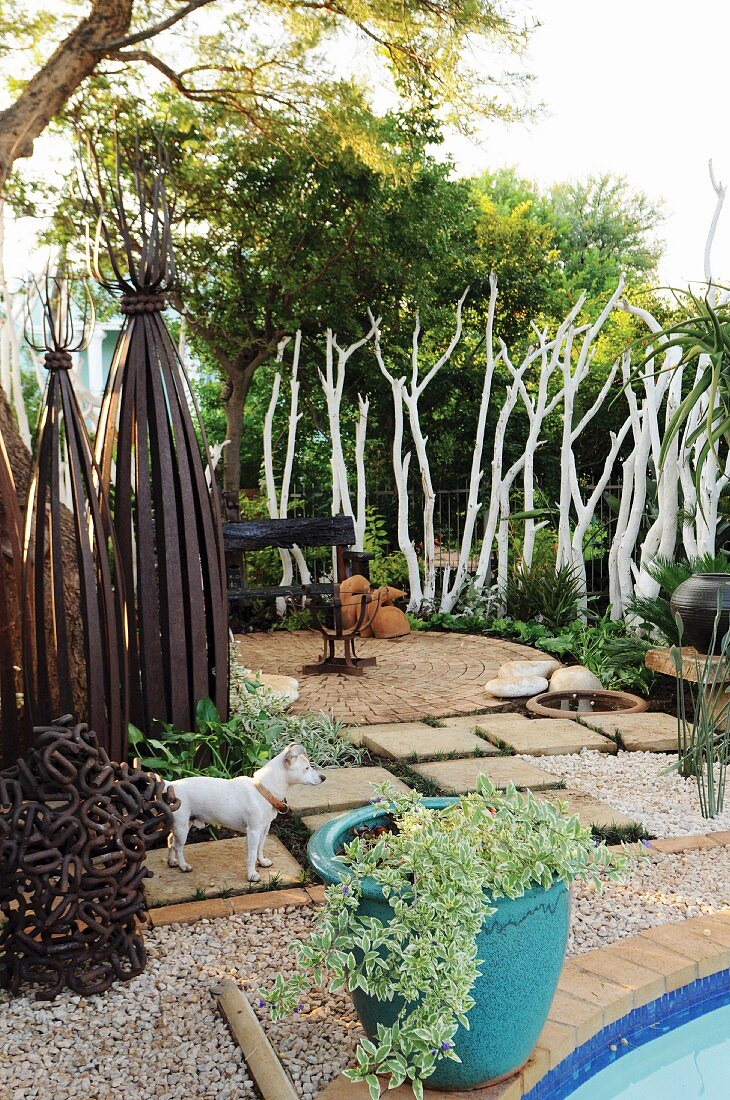 Artistically designed garden seating area with fire basket