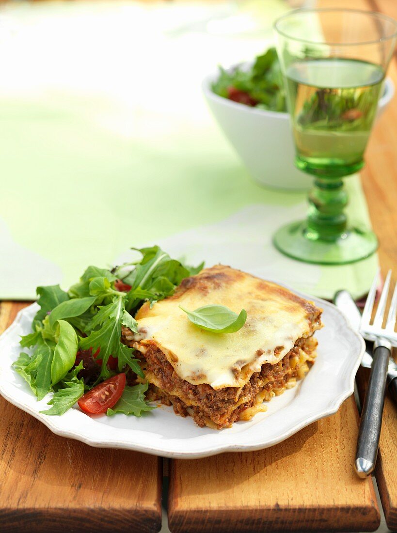 Lasagne with minced beef on a wooden table