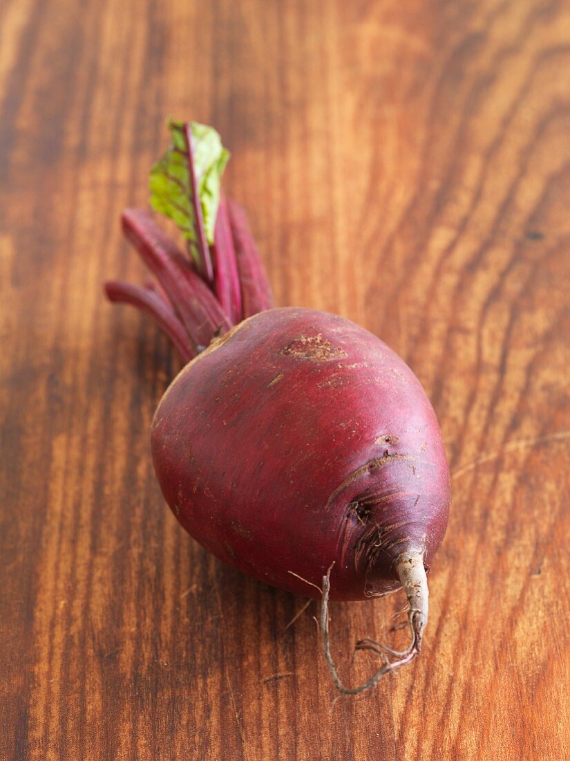 A beetroot on a wooden surface