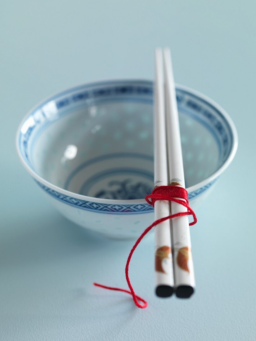 A Chinese bowl and chopsticks