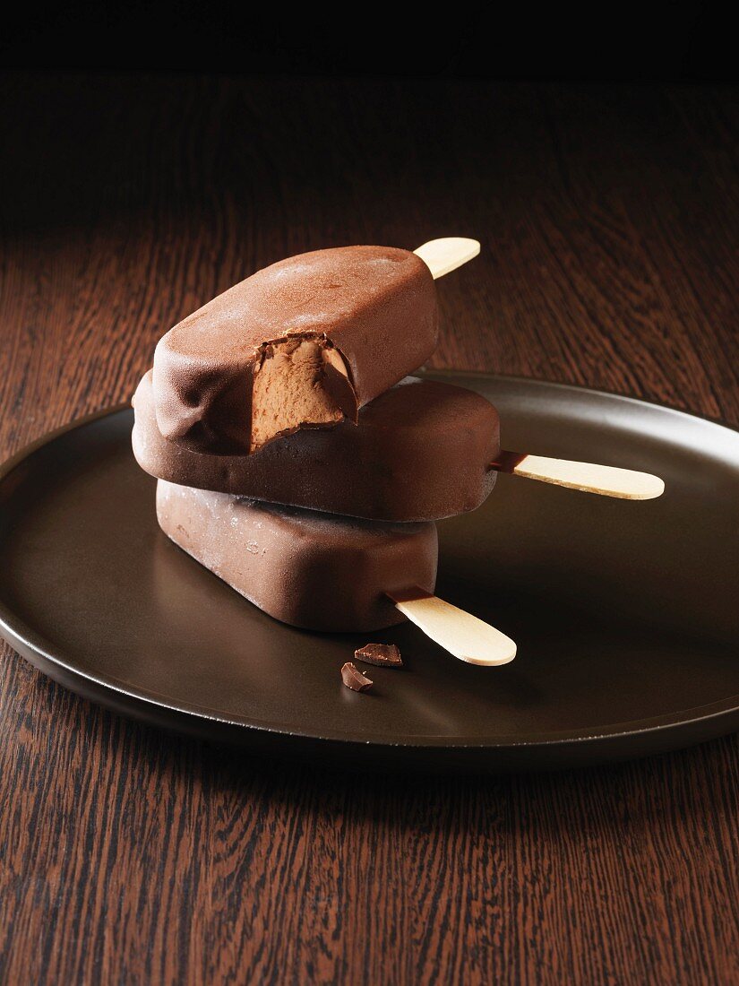 Chocolate-coated ice cream on a stick