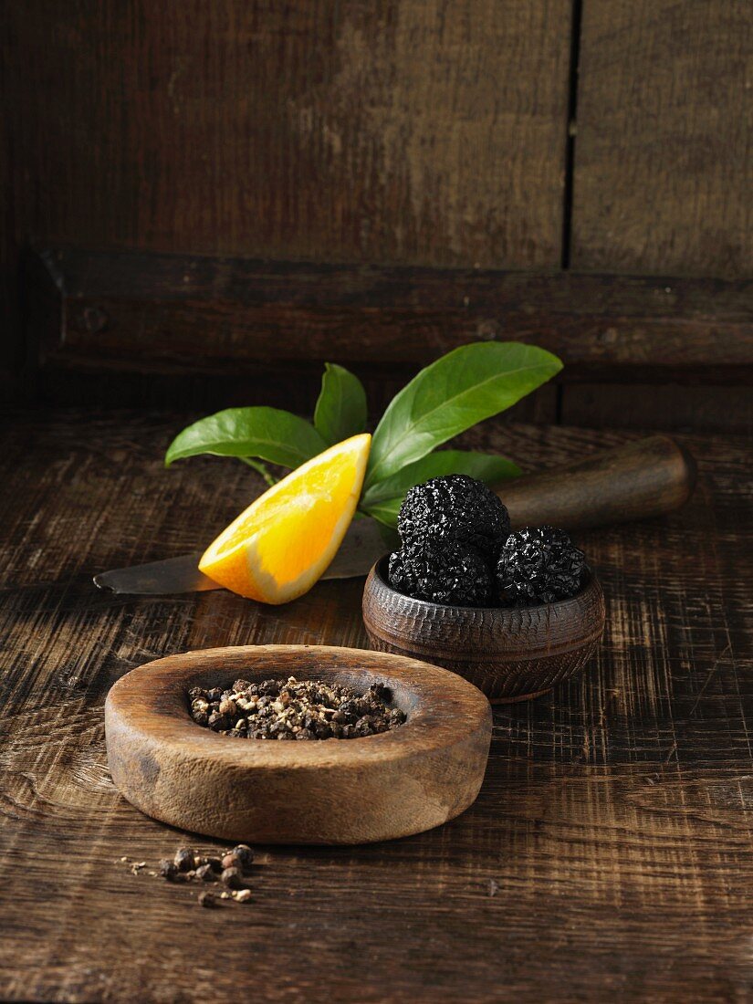 Black truffles, peppercorns and orange