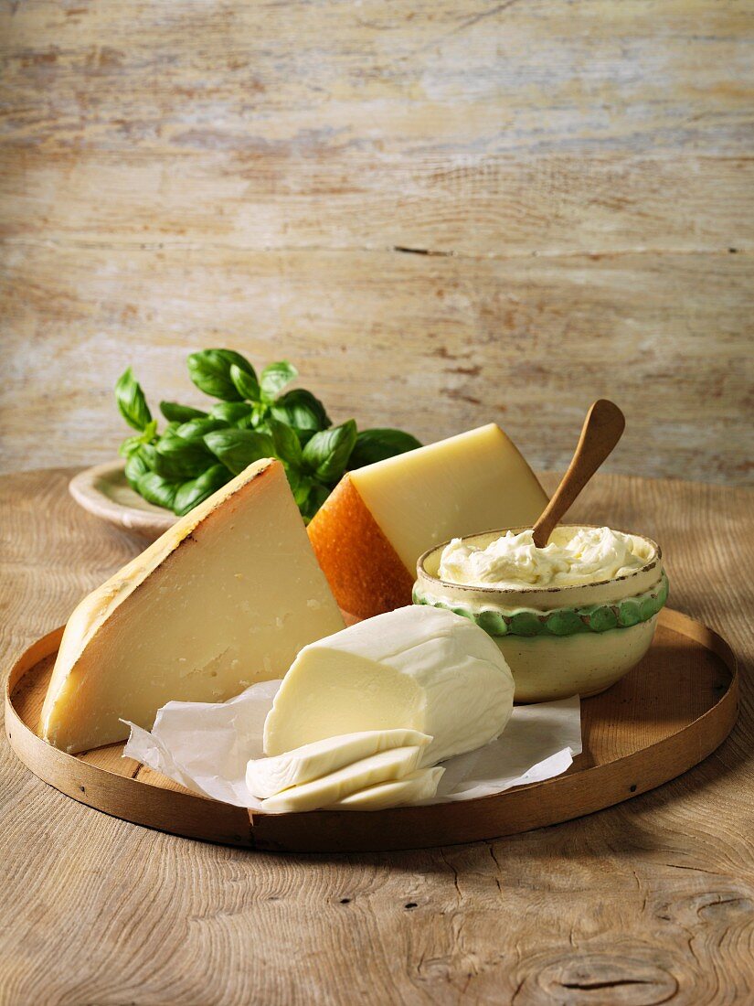 Italian cheeses on wooden board