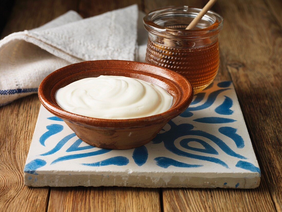 Greek yogurt and honey on tile