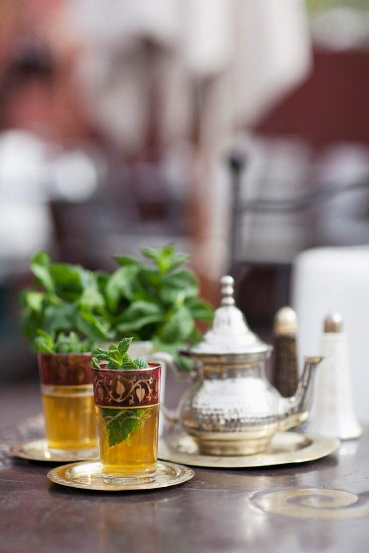 Glasses of mint tea on table