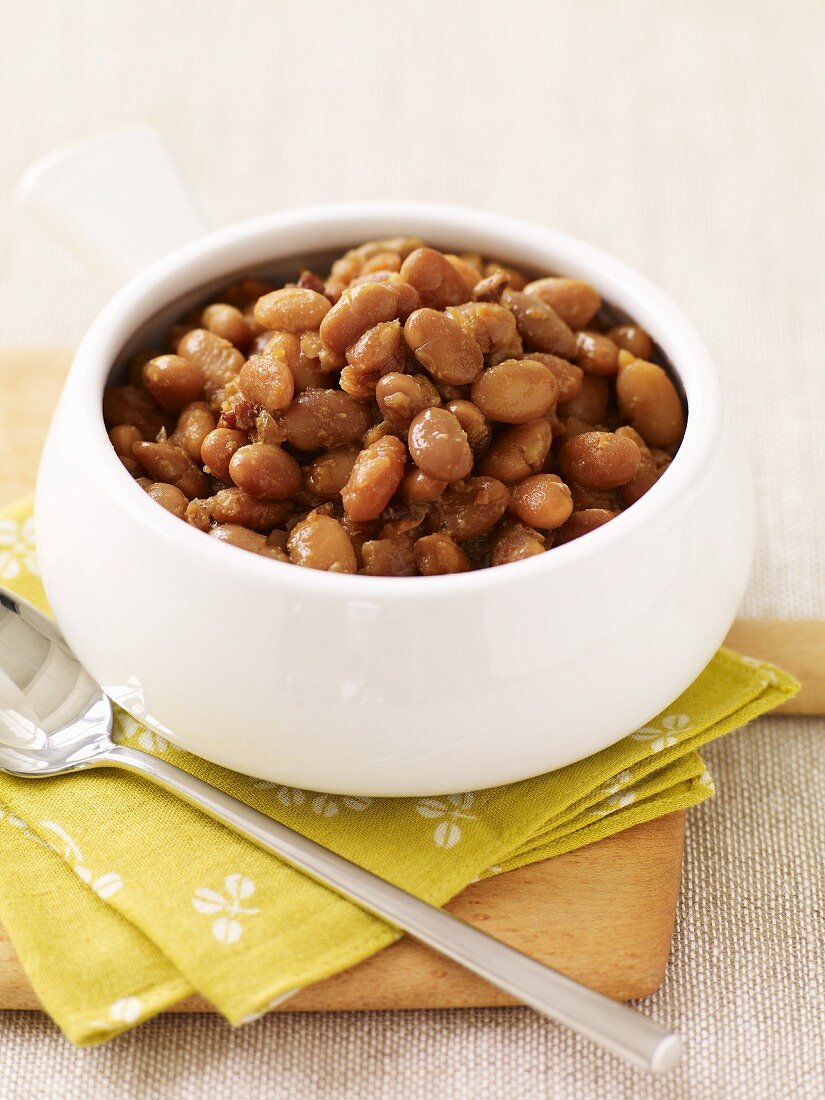 Bowl of Baked Beans with a Spoon