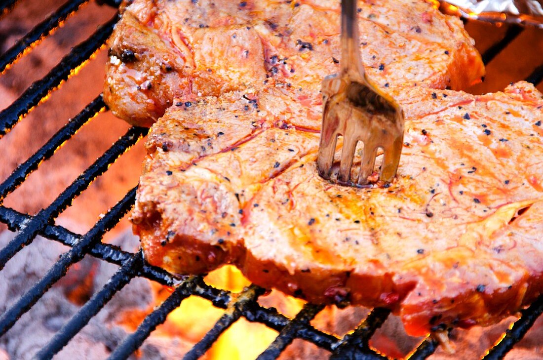 Pork steaks on a barbecue