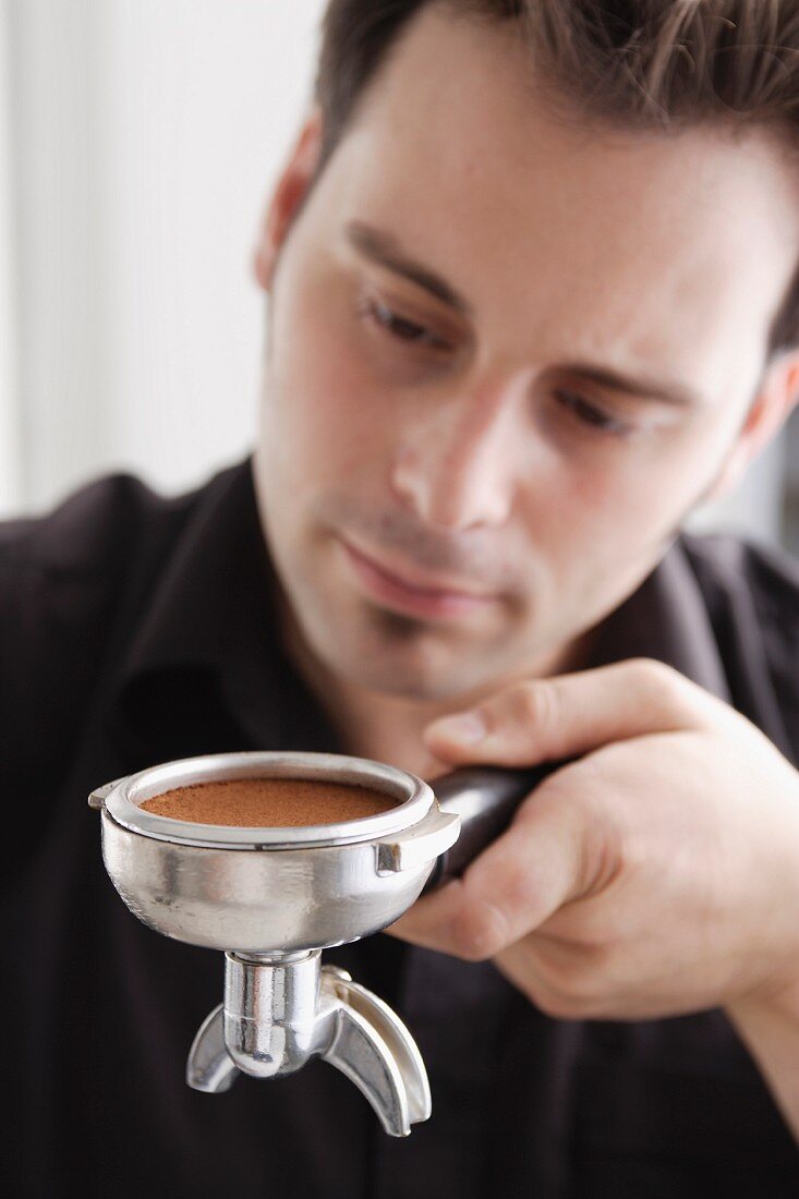 A barrista preparing espresso