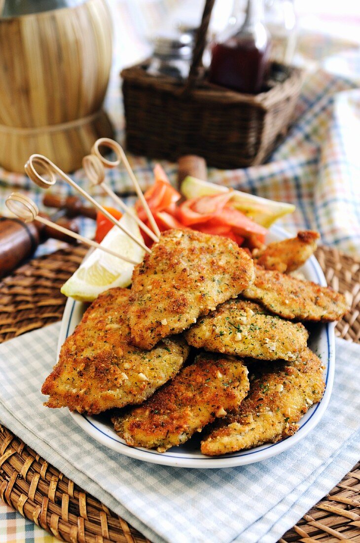 Breaded chicken breast with a cheese, parsley and pine nut crust