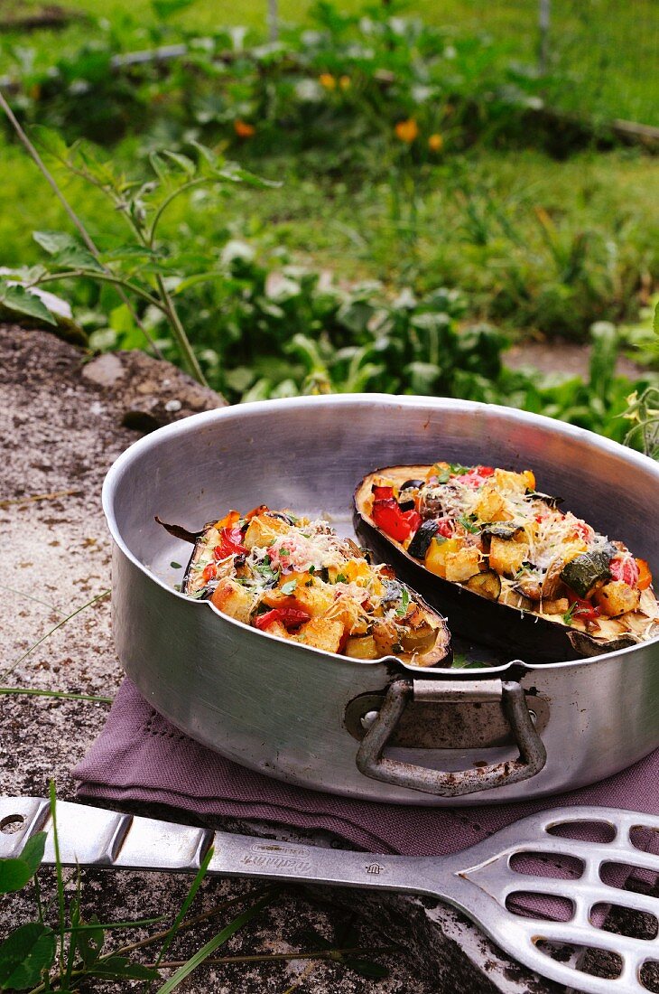 Aubergines filled with peppers, courgettes and croutons