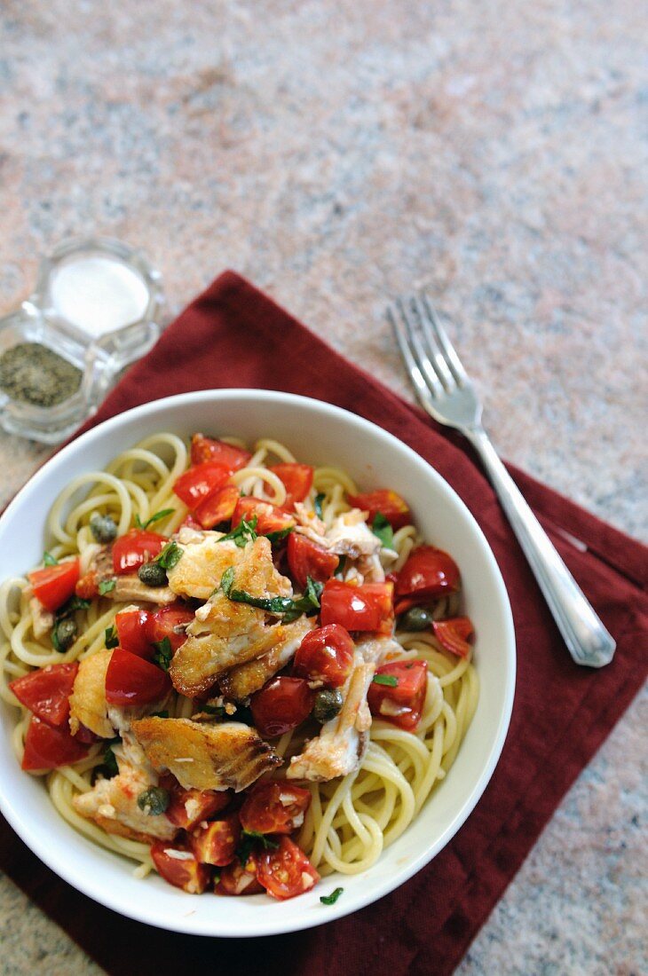 Spaghetti with haddock, tomatoes and capers (seen from above)