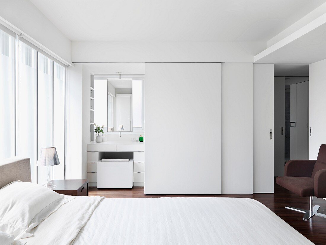 Modern white bedroom with hardwood floors