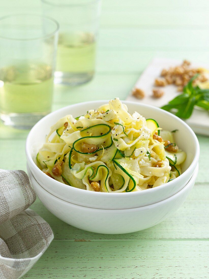 Bowl of pasta with sliced zucchini