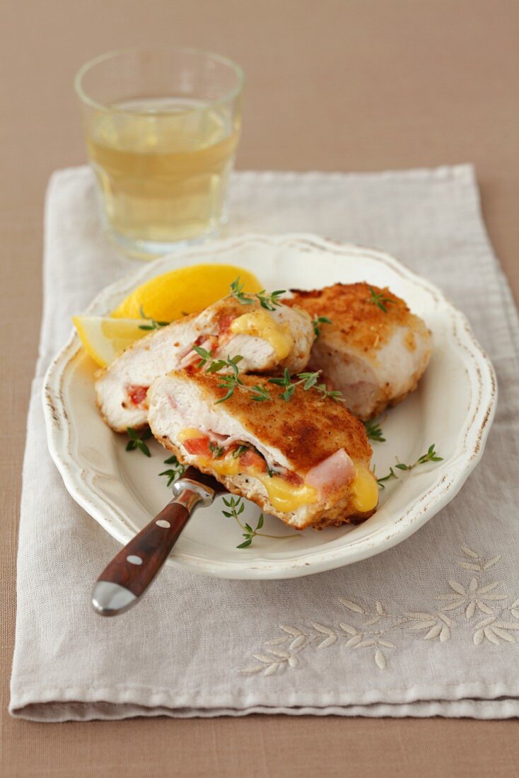 Stuffed chicken breast with ham, cheese, tomatoes and thyme